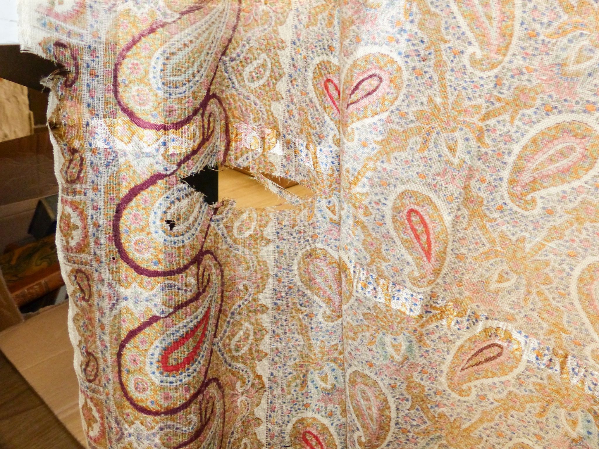 A Paisley pattern silk shaw (damaged) together with two Kelim woven bags (3)